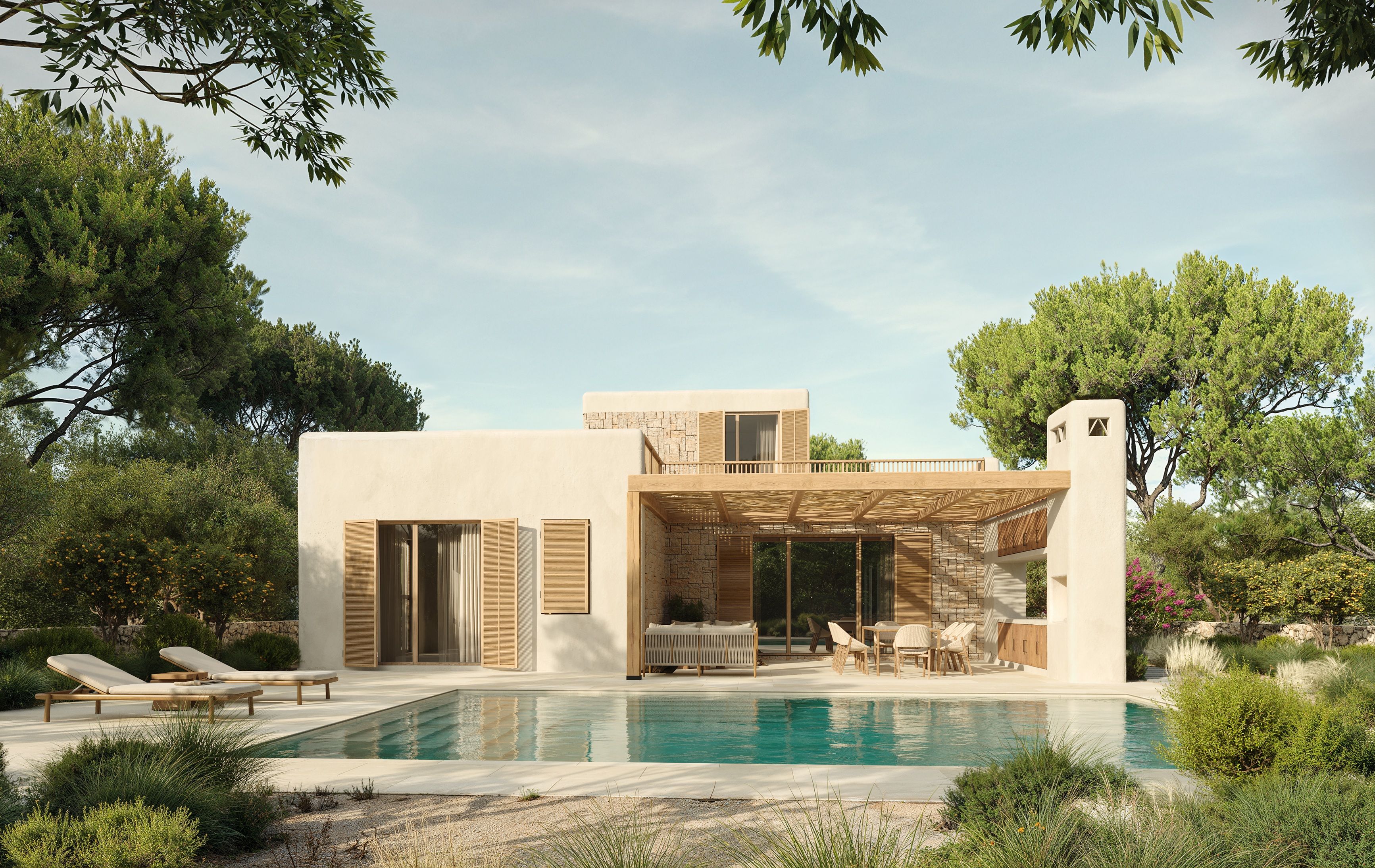 Villa mediterránea en l'Ametlla de Mar vista desde la piscina, con su fachada principal elevándose entre los pinos